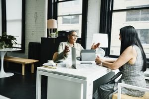 Financial advisor in discussion with a client in an office