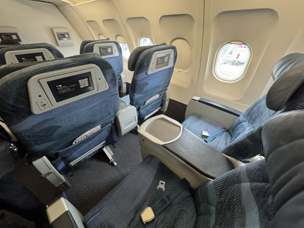 Overhead view of wider seats up front on the A320.