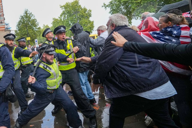 Protesters clash with police at the "Unite The Kingdom" rally.
