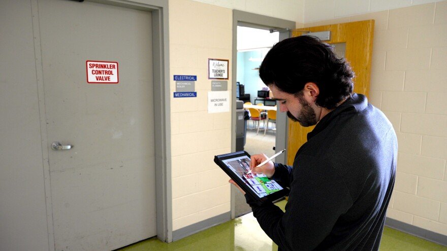 A Critical Response Group team member maps a school during a CRG walk-through.