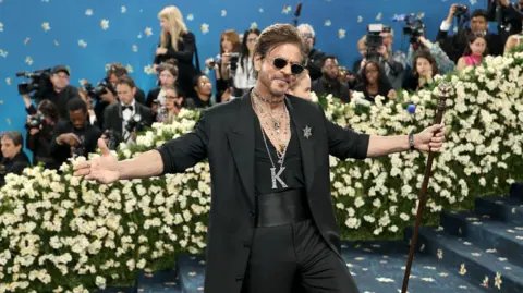 GA/The Hollywood Reporter via Getty Images Shah Rukh Khan strikes a crowd favourite pose at the 2025 Met Gala in New York City